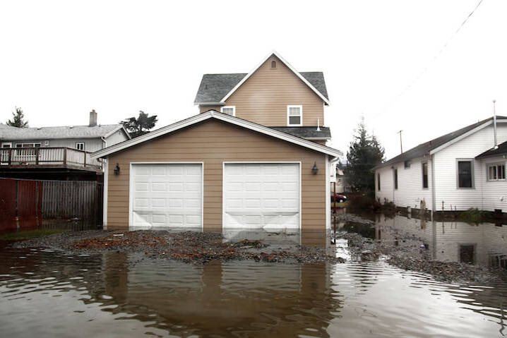 garage view of a flooded home