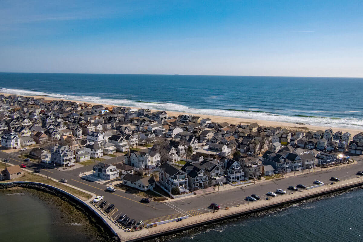 sky view of homes on the shore of a beach