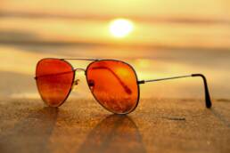 sunglasses on beach during summer