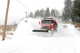 Truck plowing snow in winter